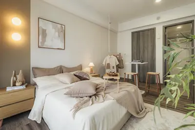 a bedroom with a large white bed and a table at NaiBnB in Agile Bukit Bintang - 5 mins walk to TRX in Kuala Lumpur