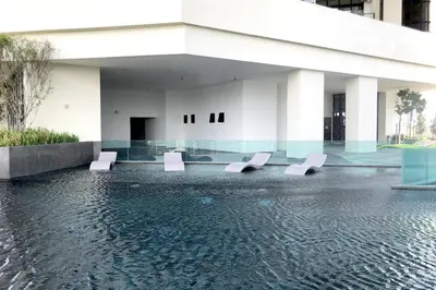 a building with a pool of water in front of it at Cheras KL Premium 3B2B by Luvit Stay in Kuala Lumpur