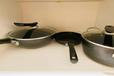 two pots and pans sitting on a kitchen counter at Cheras KL Premium 3B2B by Luvit Stay in Kuala Lumpur