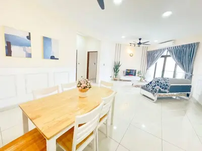 a dining room with a wooden table and chairs at Cheras KL Premium 3B2B by Luvit Stay in Kuala Lumpur