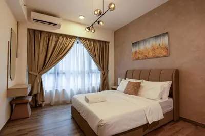 a bedroom with a large bed and a window at Ayatt Bukit Bintang in Kuala Lumpur