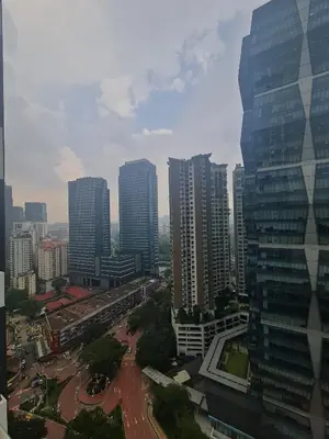 a view of a city with tall buildings at Muji Themed Apartment by Zen Sojourn - Opposite KL SENTRAL in Kuala Lumpur