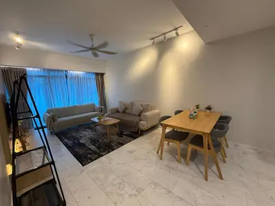 a living room with a couch and a table at Eaton Residence Klcc By Apple in Kuala Lumpur