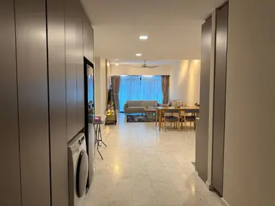 a living room with a table and a dining room at Eaton Residence Klcc By Apple in Kuala Lumpur