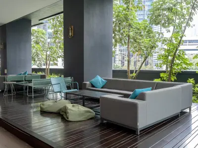 a living room with a couch and a table at Star KLCC Elegant 2-3pax by DingDing in Kuala Lumpur