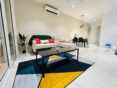 a living room with a couch and a table at Quill Residence KL by DeUrban in Kuala Lumpur