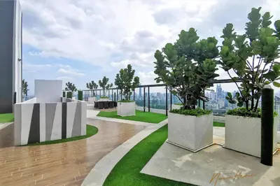 a balcony with two potted trees on a building at NowHere 2BR 4PAX with Balcony Reizz Jalan Ampang in Kuala Lumpur
