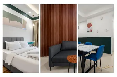 a hotel room with a bed and a table and a chair at NowHere 2BR 4PAX with Balcony Reizz Jalan Ampang in Kuala Lumpur
