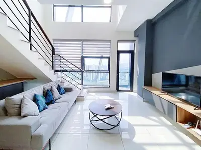 a living room with a couch and a table at Arte mont kiara by Sweet home in Kuala Lumpur