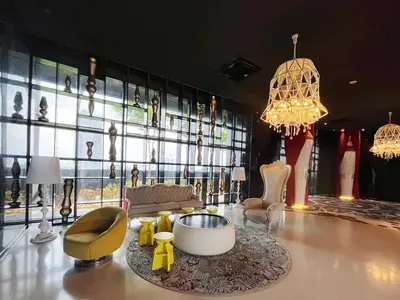 a living room filled with furniture and a large window at Arte mont kiara by Sweet home in Kuala Lumpur
