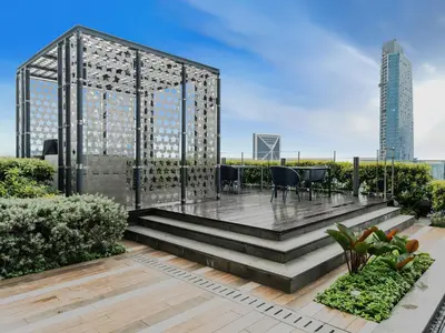 a garden with a gazebo on the roof of a building at Star Premier KLCC Suite 3-4pax by LavishHome in Kuala Lumpur