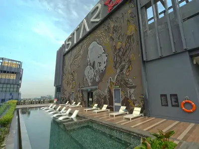 a building with a mural on the side of it at Star Premier KLCC Suite 3-4pax by LavishHome in Kuala Lumpur