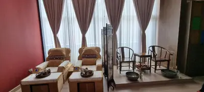 a living room with two chairs and a table at Star Premier KLCC Suite 3-4pax by LavishHome in Kuala Lumpur