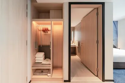 a room with a door leading to a bedroom at Holiday Inn Kuala Lumpur Bangsar by IHG in Kuala Lumpur