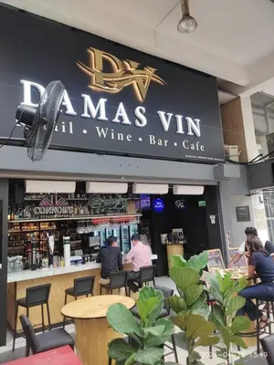 a restaurant with a sign for a wine bar cafe at KL Dorsett Damas Grandeur Suite-F-Parking, Self C-In in Kuala Lumpur