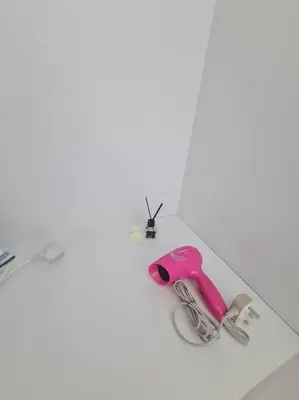 a pair of pink scissors on a white table at KL View 3BedRoom 2carpark MRT Station Cheras Maluri FreeWifi C41 in Kuala Lumpur