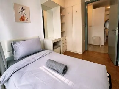 a bedroom with a white bed with a towel on it at Bintang Fairlane Residence, Cozy Fam Suite with Bathtub - 2B2R in Kuala Lumpur