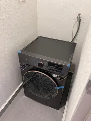 a washer and dryer sitting next to a wall at 2R2B Chan Sow Lin Trion 2 - 6 pax in Kuala Lumpur