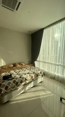a bedroom with a bed and a window at City Centre KLCC in Kuala Lumpur