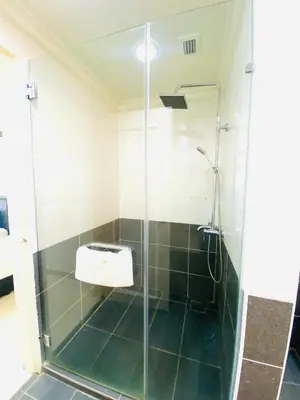 a shower with a glass door in a bathroom at Unique Suite Times Square at Bukit Bintang Kuala Lumpur in Kuala Lumpur