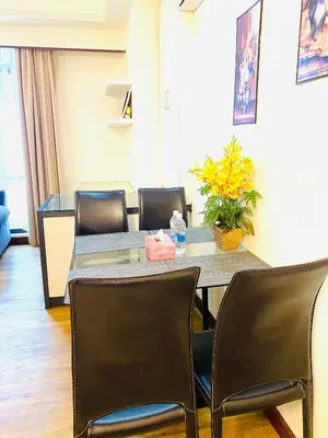 a dining room with a table and chairs at Unique Suite Times Square at Bukit Bintang Kuala Lumpur in Kuala Lumpur