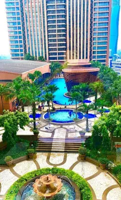 a view of a fountain in a city with tall buildings at Times Square Super Suites at Bukit Bintang KL in Kuala Lumpur