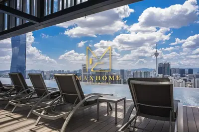 a row of chairs on a deck with a view of the city at Maxhome Retreat at Lucentia in Kuala Lumpur