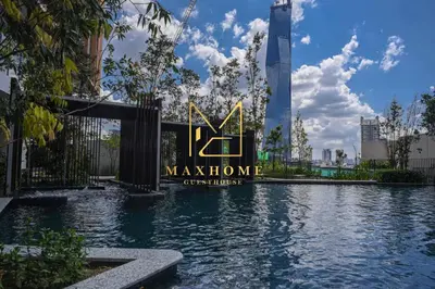 a swimming pool with a sign in front of a building at Maxhome Retreat at Lucentia in Kuala Lumpur