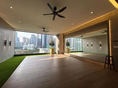 a living room with a ceiling fan and a large window at The Little Series - Bukit Bintang - TRX View - 4 Pax in Kuala Lumpur