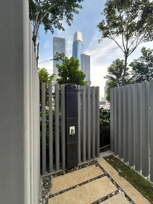 a fence with a gate with a city in the background at The Little Series - Bukit Bintang - TRX View - 4 Pax in Kuala Lumpur