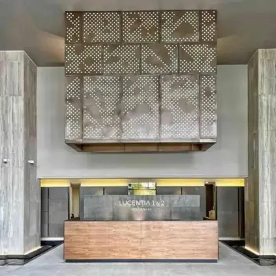 a lobby of a luxury hotel with a large chandelier at Maxhome Elite at Lucentia in Kuala Lumpur