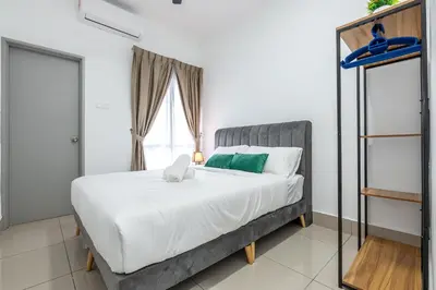 a bedroom with a bed and a window at 5min to KL TRX Bukit Bintang for 6paxs in Kuala Lumpur