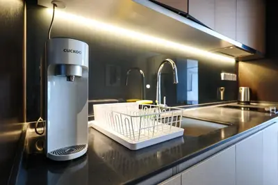 a kitchen with a juicer sitting on a counter at Scarletz Suites KLCC by GB in Kuala Lumpur
