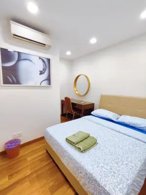 a bedroom with a bed and a table and a mirror at Comfy Stay at Wisma Cosway Pavilion KLCC Bukit Bintang in Kuala Lumpur