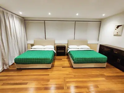 two beds sitting next to each other in a room at Comfy Stay at Wisma Cosway Pavilion KLCC Bukit Bintang in Kuala Lumpur