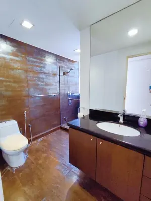 a bathroom with a toilet and a sink and a mirror at Comfy Stay at Wisma Cosway Pavilion KLCC Bukit Bintang in Kuala Lumpur