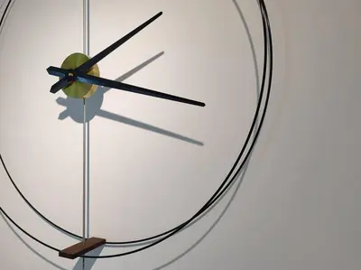 a close up of a clock on a wall at M 2-7pax 200mbpswifi near Mrt Lrt HKL IJN in Kuala Lumpur