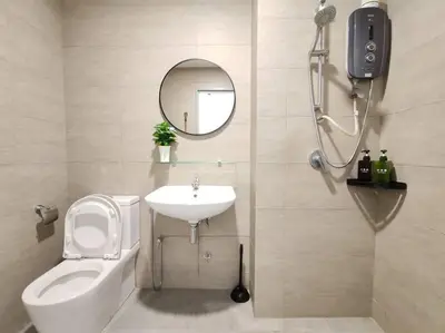 a bathroom with a sink and a toilet and a mirror at M 2-7pax 200mbpswifi near Mrt Lrt HKL IJN in Kuala Lumpur