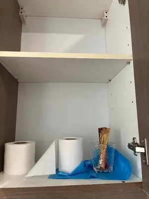 a shelf with two rolls of toilet paper and a bowl at Parkview Service Apartment By Bonjour in Kuala Lumpur