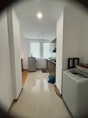a kitchen with a washer and dryer in a room at Parkview Service Apartment By Bonjour in Kuala Lumpur