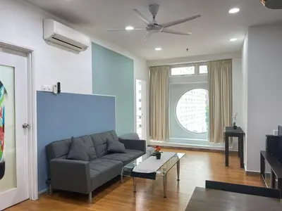 a living room with a couch and a table at Parkview Service Apartment By Bonjour in Kuala Lumpur
