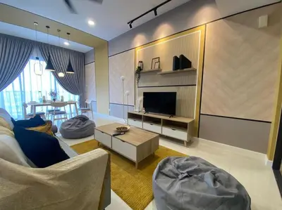 a living room with a couch and a television at Lemon Loft 2BR opposite MyTown near TRX by RumaBnB in Kuala Lumpur