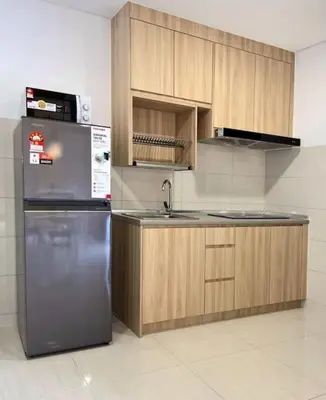 a kitchen with a stainless steel refrigerator and wooden cabinets at Lemon Loft 2BR opposite MyTown near TRX by RumaBnB in Kuala Lumpur