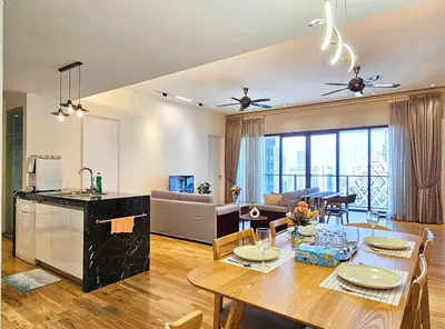 a kitchen and living room with a table and a dining room at St Mary KLCC Luxury 3BR High End Residence 7min Walk to Pavilion and Bukit Bintang by Cloud Host in Kuala Lumpur