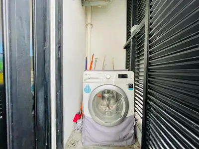 a washing machine in a room with a wall at EST Bangsar KL Sentral by DeUrban in Kuala Lumpur