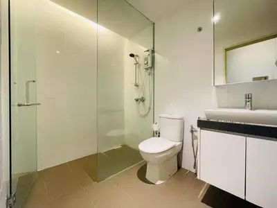 a bathroom with a toilet and a shower and a sink at EST Bangsar KL Sentral by DeUrban in Kuala Lumpur