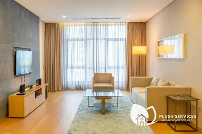 a living room with a couch and a tv at 188 Premium Suites by Plush in Kuala Lumpur