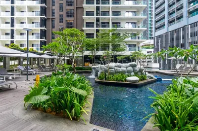 a courtyard with a fountain in the middle of a building at 188 Premium Suites by Plush in Kuala Lumpur