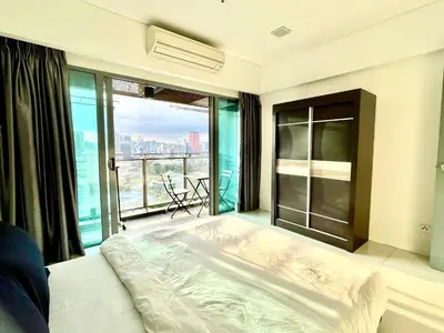 a bedroom with a bed and a large window at KL CITY CENTRE nearby KLCC in Kuala Lumpur