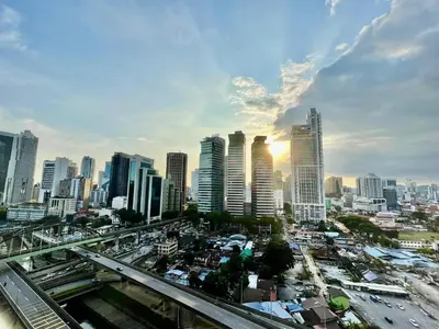 a city skyline with tall buildings and a freeway at KL CITY CENTRE nearby KLCC in Kuala Lumpur